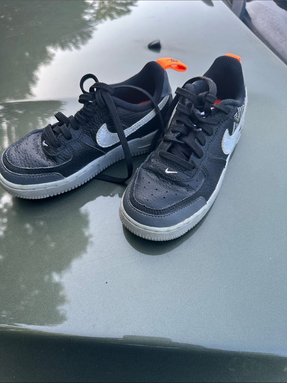 Nike Black Sneakers with Silver Swoosh and Orange Heel Tabs